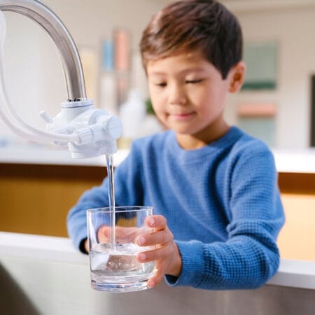 Boy getting filtered water